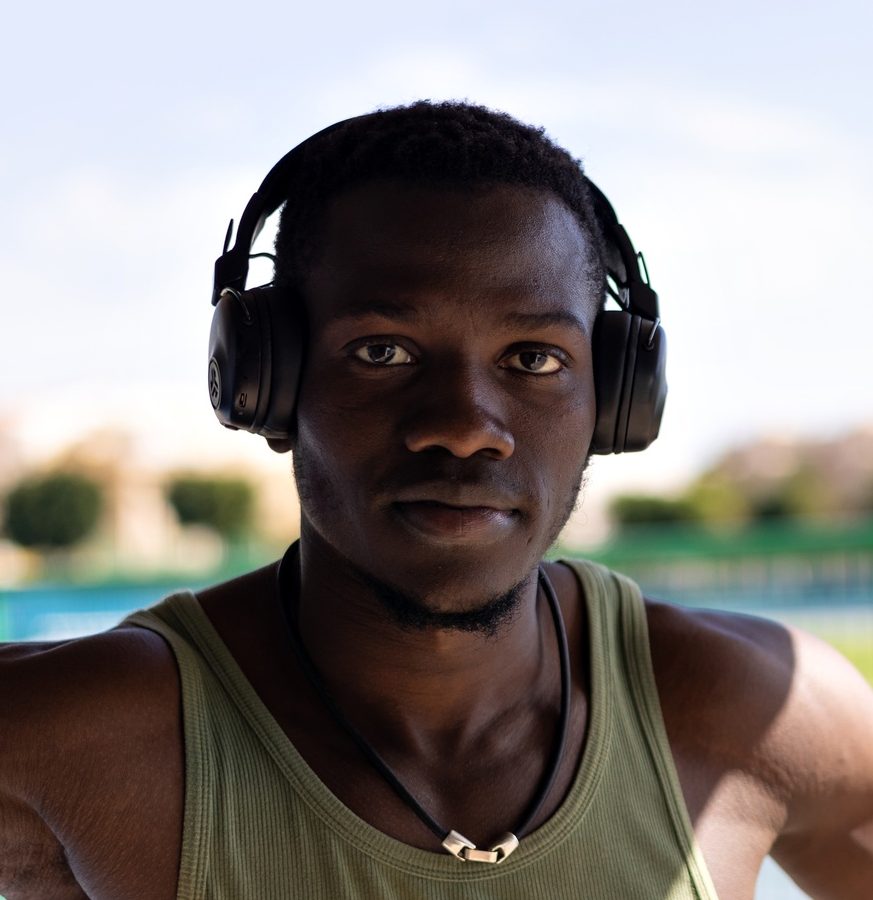 Portrait of African athlete with athletics track background