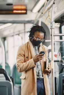 Young African businessman standing in a bus Young African businessman standing in a bus